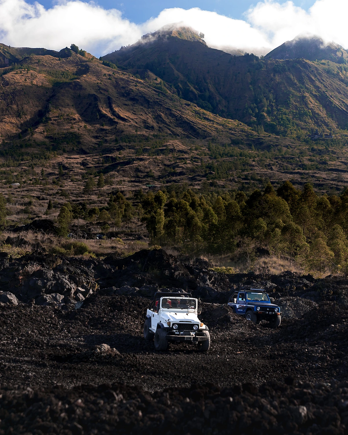 Black lava landscape explored during Mount Batur Jeep Sunrise Tour