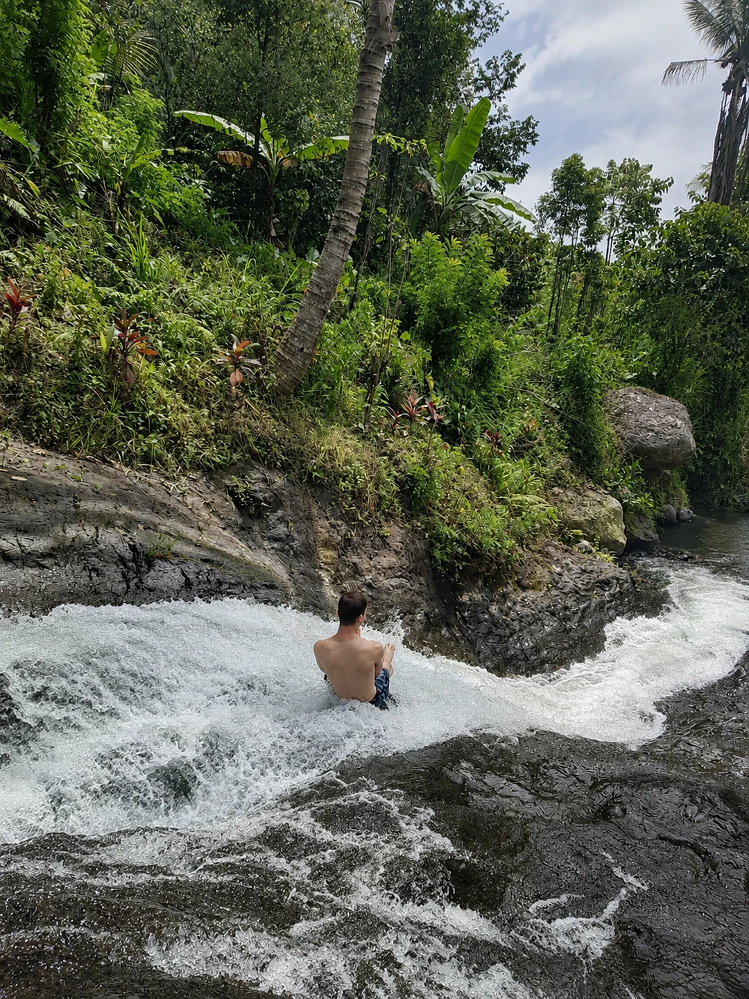 Natural waterslide at Sekumpul Waterfall