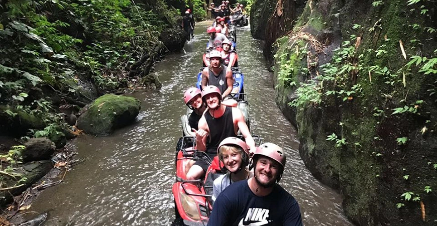 Adventure seekers riding ATV through nature in Ubud Bali