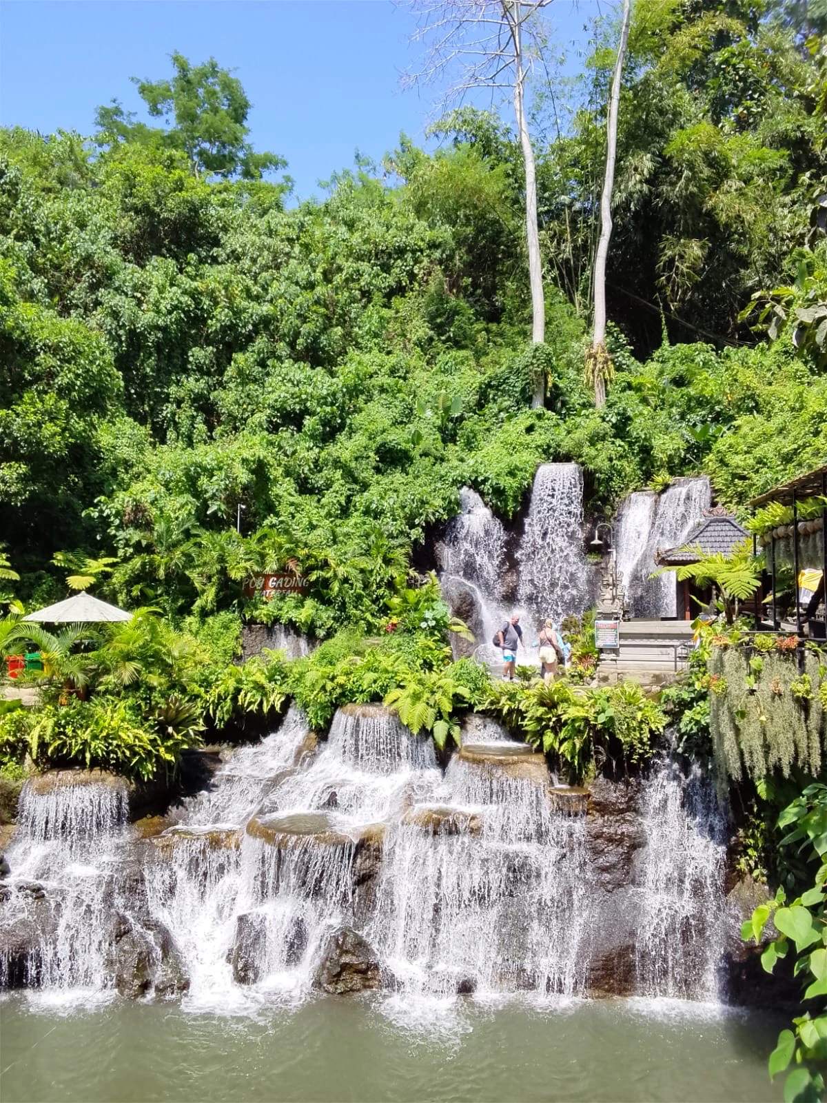 Poh Gading Waterfall surrounded by tropical greenery